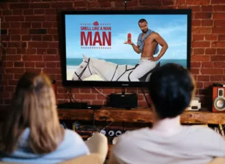 couple watching old spice commercial